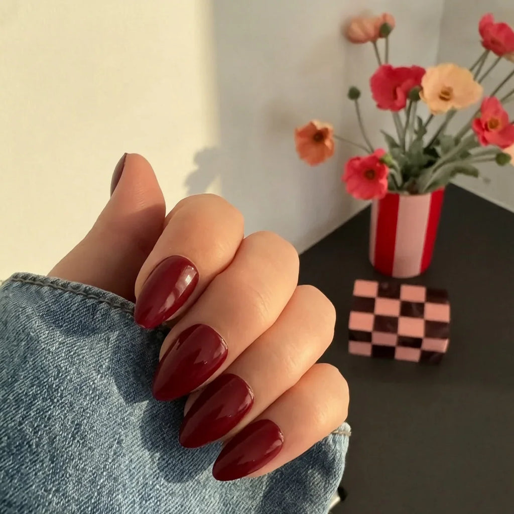 Glossy Maroon Almond Nails