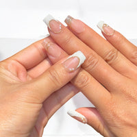 White wavy French Tip Nails With Gold Detailing Nail O Lash